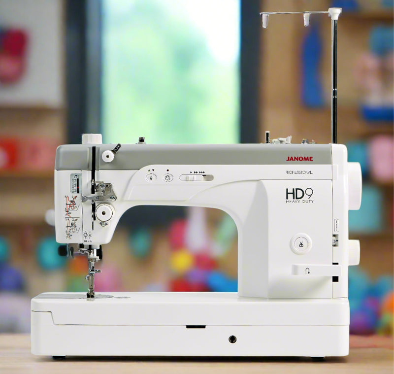 Janome HD9, a straight stitch semi-industrial machine with a flatbed and a large handwheel.